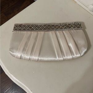 Elegant Cream Clutch with Silver Accents
